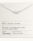 The Sisters Links Necklace by Becoming Jewelry is a silver necklace with an infinity knot pendant, elegantly displayed on a card that features a Christina Rossetti quote about the connection of friendship.