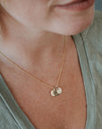 Sun moon and stars necklace on model