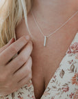 through thick and thin necklace on model